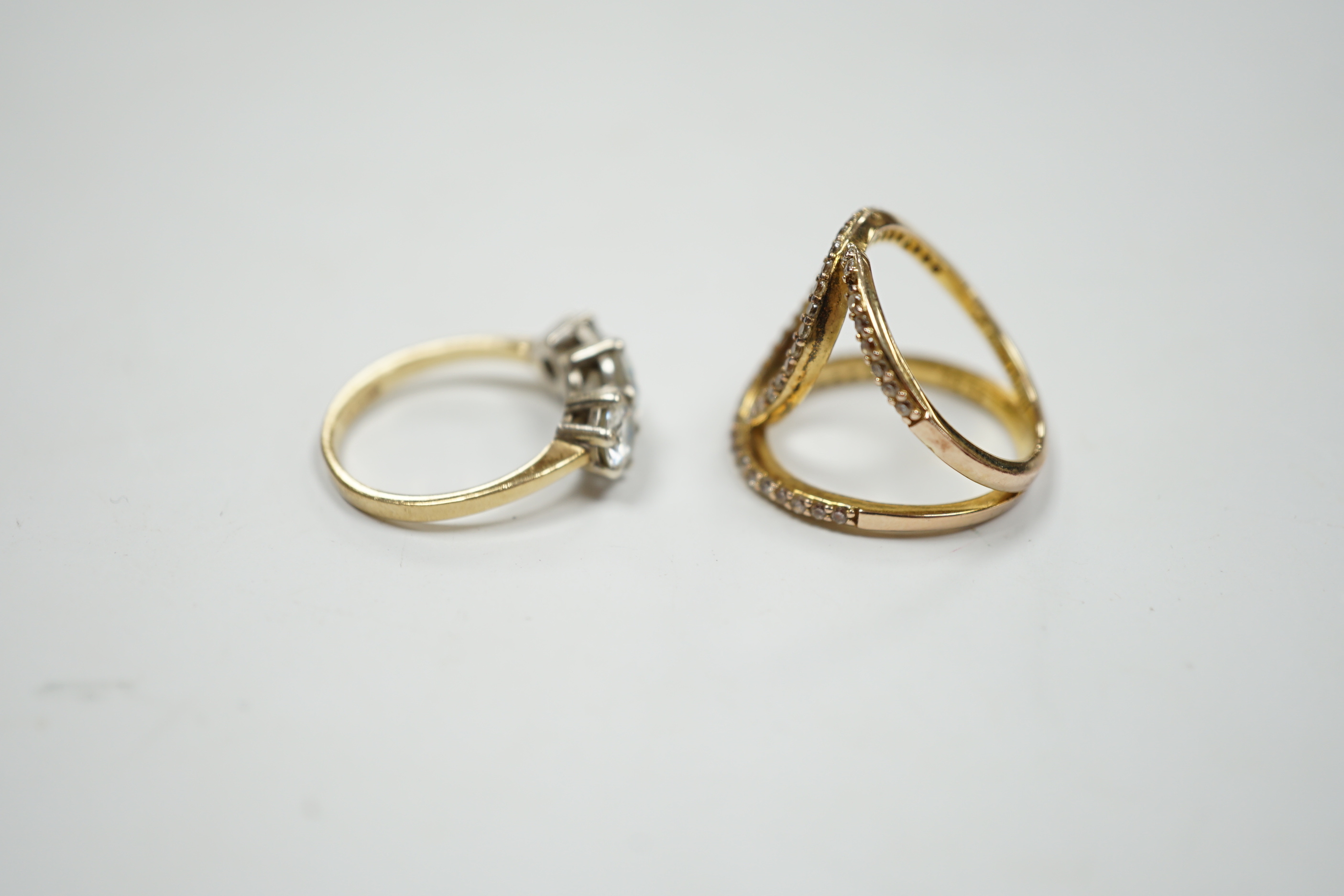 A 9ct gold and three stone simulated diamond ring and a gilt 925 ring.